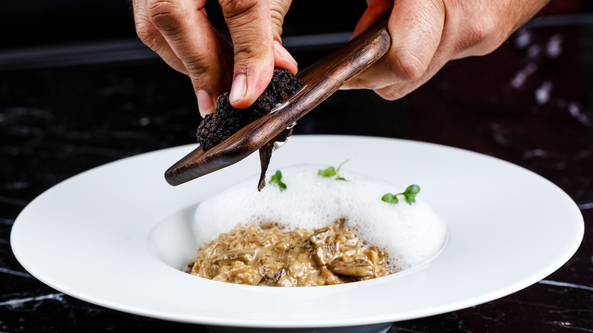 Black Truffles being grated over food